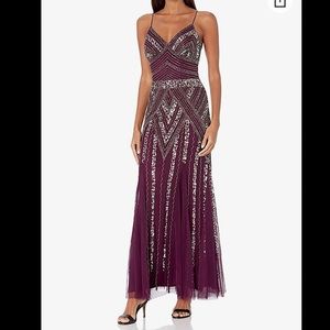 Long purple beaded v neck gown with spaghetti straps